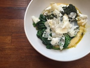 Poached eggs with polenta, charmoula, braised spinach.