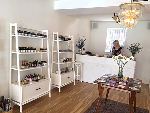 Catherine Foley behind the counter at Help Your Self.