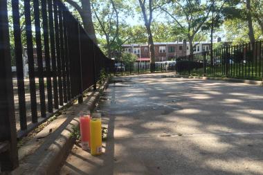Candles were placed at the site of the shooting. Photo via DNAinfo/William Mathis