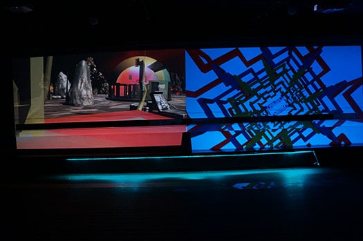 Projections of Miyo Van Stenis' "War Room" (left) and Brenna Murphy's work (right)