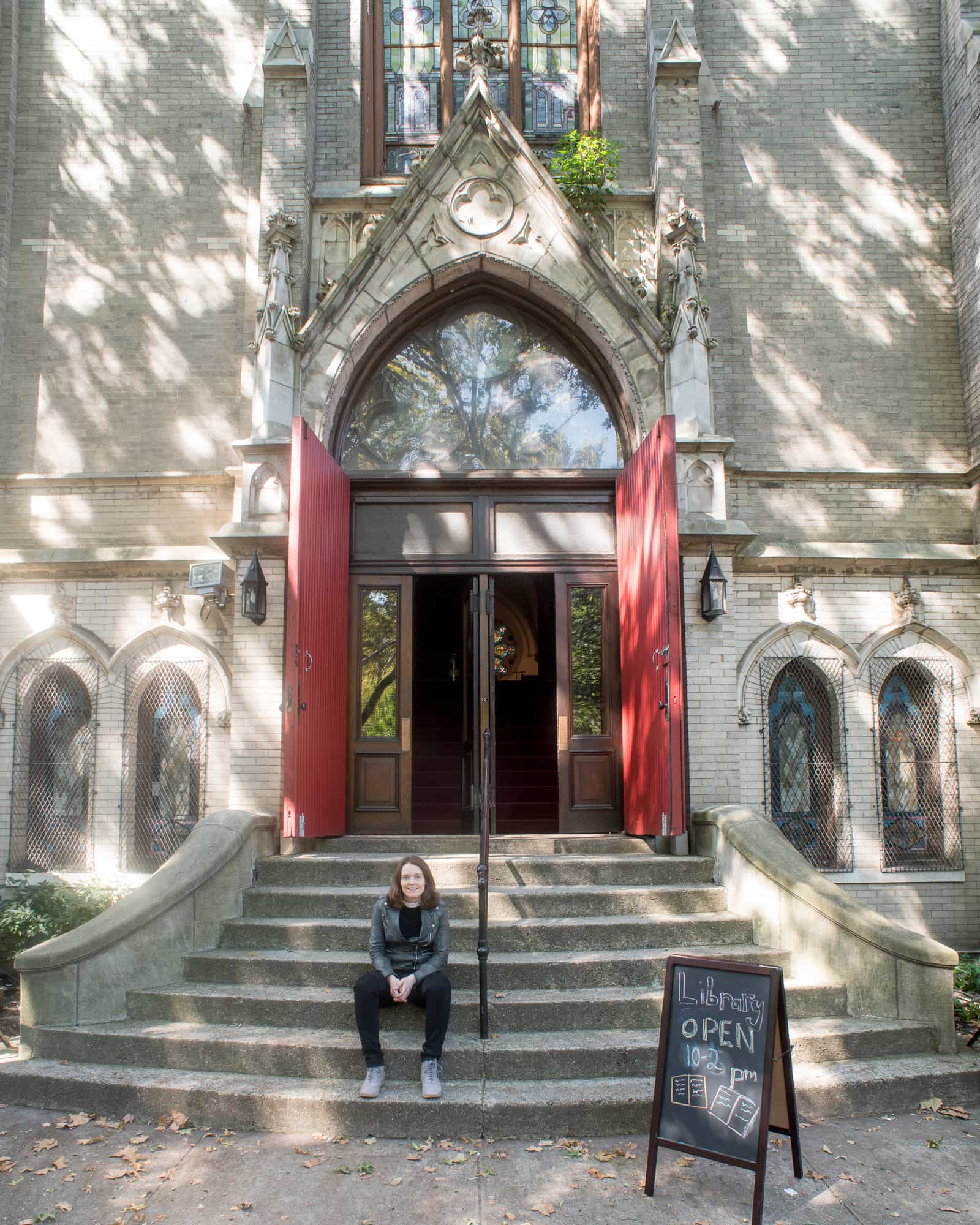 Pastor Amy in front of the Park Church Co-Op on Russell Street.