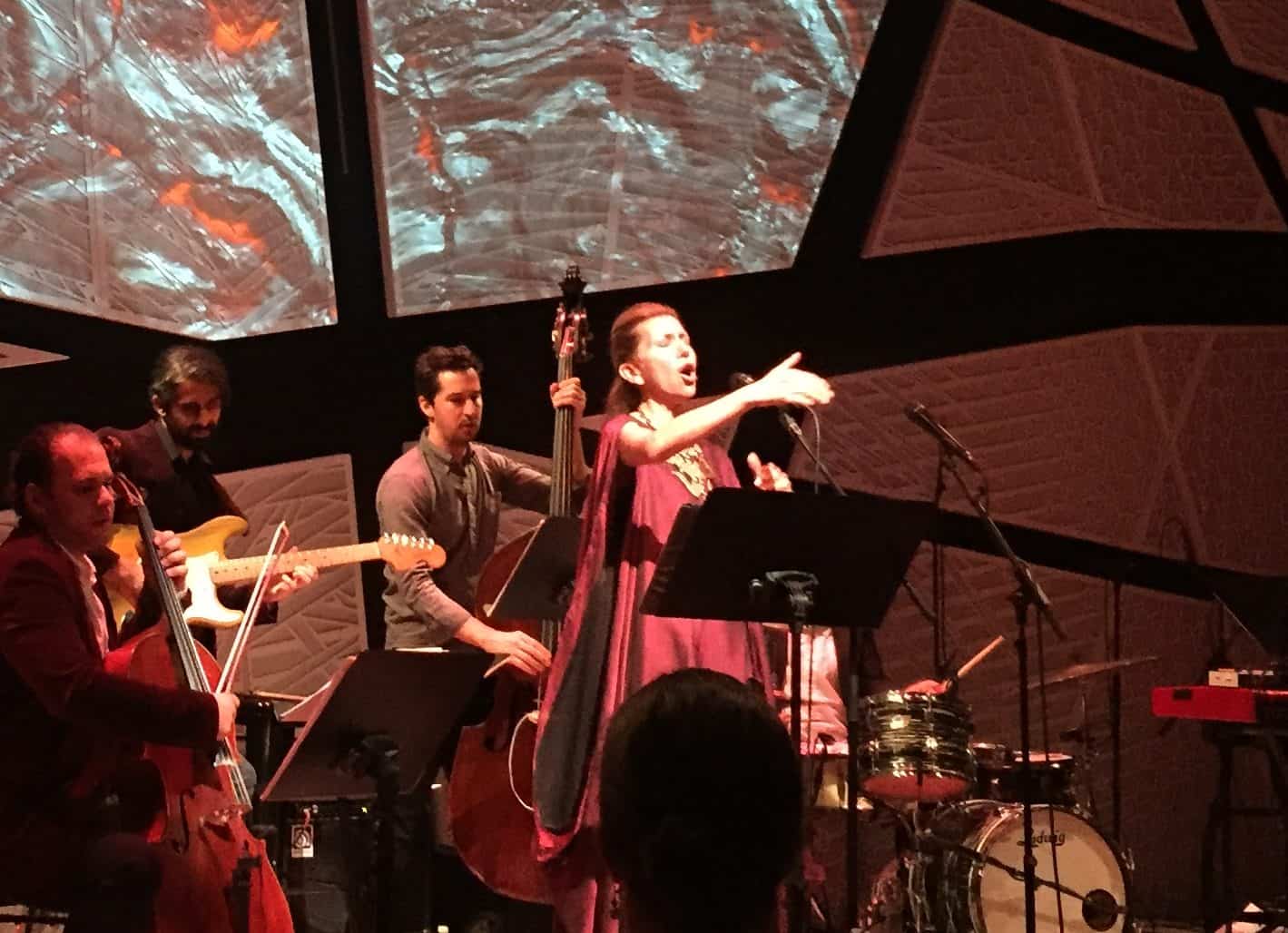 Singer Magos Hererra and the musical ensemble during the third course FIRE, during Elements of Time + Taste at National Sawdust. Photo: Megan Penmann