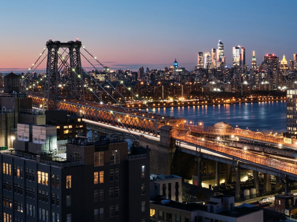 bridge over body of water during night time