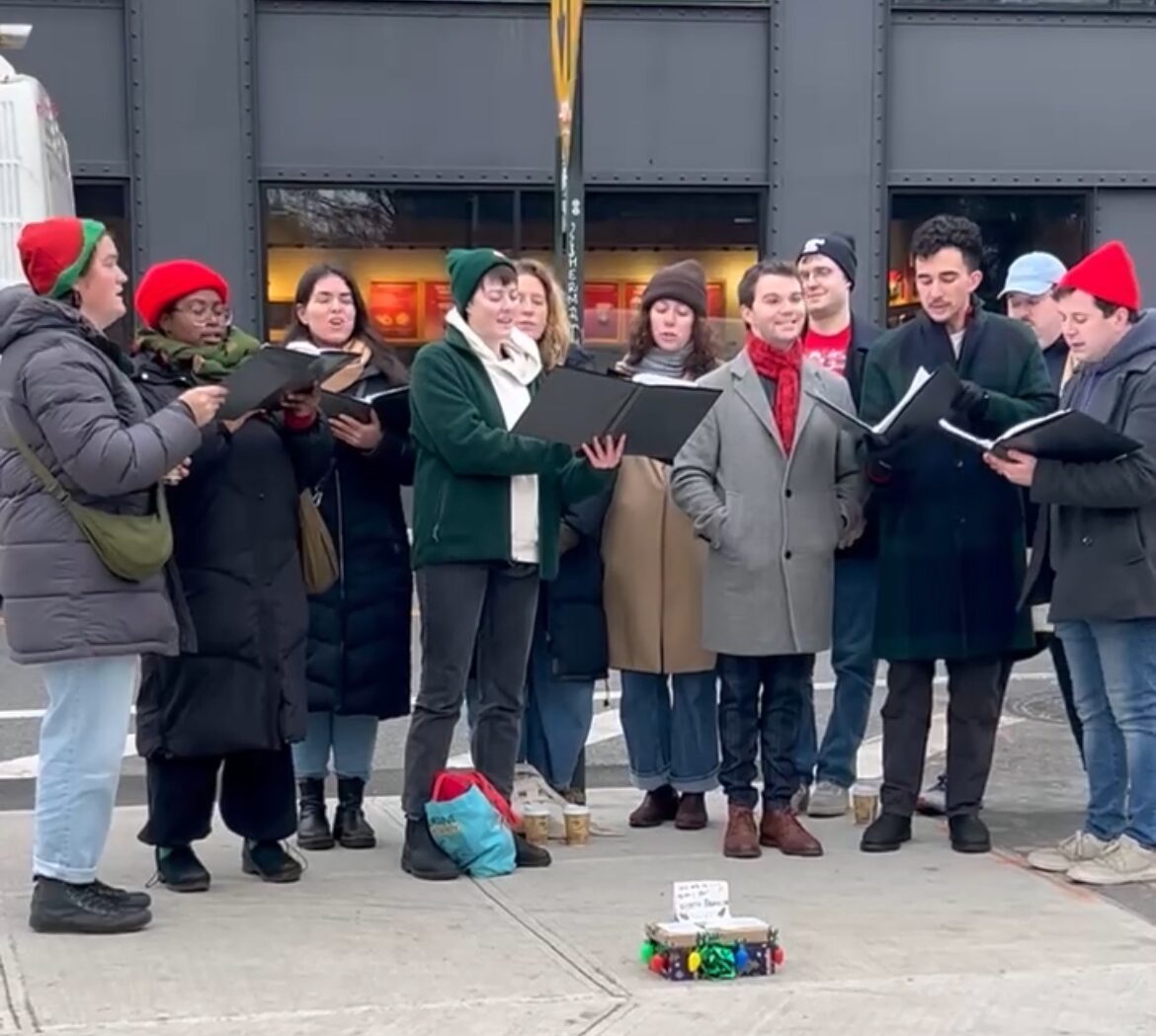 The Evergreenpoint Carolers singing in Greenpoint in 2024